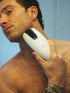 Man using the Bondi Body V2 IPL device on his jawline and neck